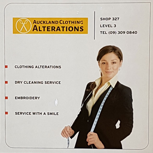 Gray Car in front of the Balmoral Drycleaners Store